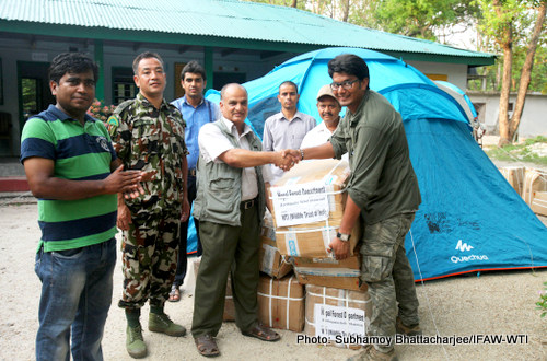 Uba Raj Regmi, Chief Warden, Parsa Wildlife Reserve (PWR) of Nepal (3rd from Left) receiving the Tents supported for by International Fund for Animal Welfare,World Land Trust and Wildlife Trust of India from Abhishek an Emergency Relief Network (ERN) member of IFAW-WTI (Extreme Right) at the head office of the park on 28th May 2015.Photo:Subhamoy Bhattacharjee/IFAW-WTI