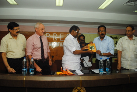 kerala-forest-minister-handing-over-the-book-to-cwlw-mr-g-harikumar1